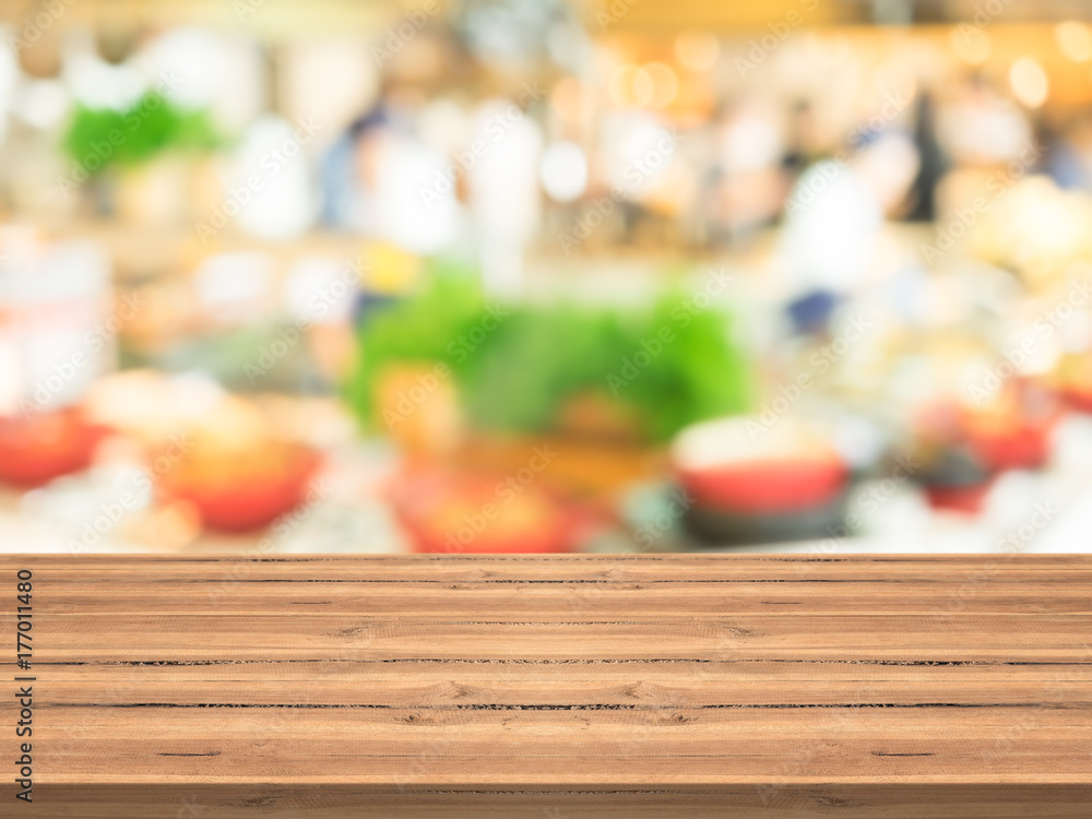 Empty wood table top on blurred background at suppermarket,copyspace for montage your products Empty wood table top on blurred background at suppermarket,copyspace for montage your products