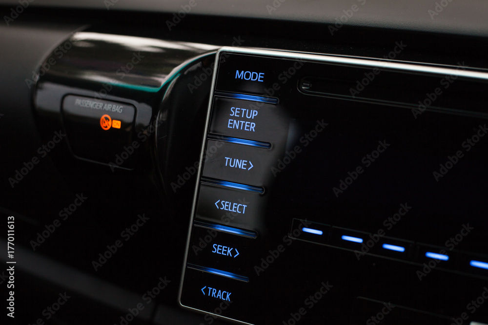 Photo of multimedia control buttons in the car. Photo of multimedia control buttons in the car.