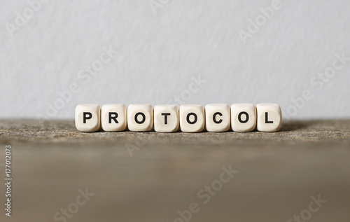 Word PROTOCOL made with wood building blocks photo