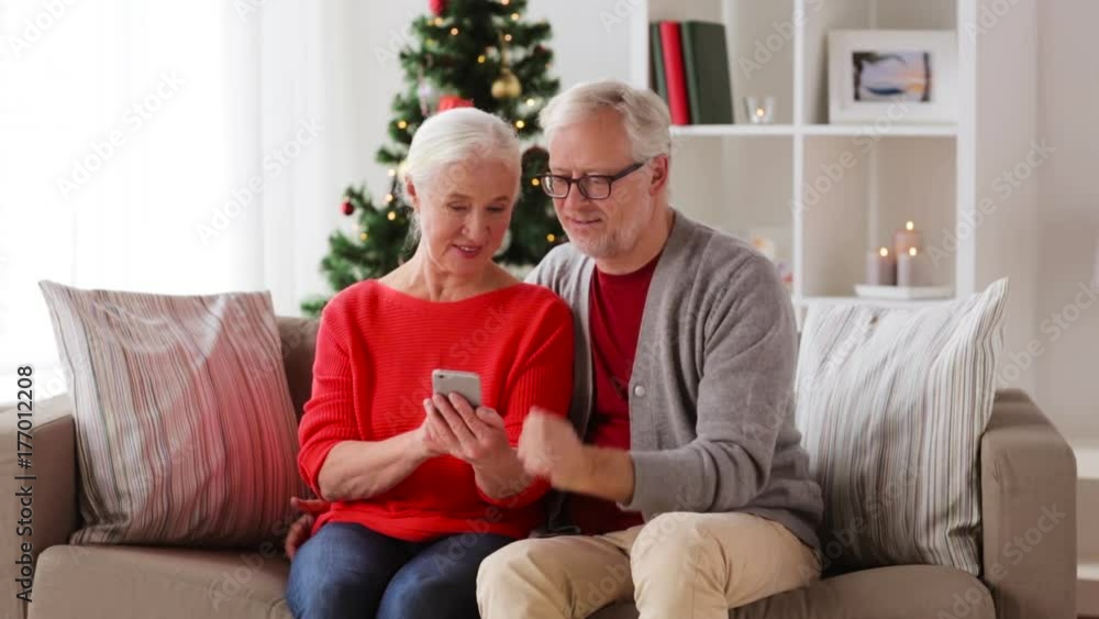happy senior couple with smartphones at home happy senior couple with smartphones at home