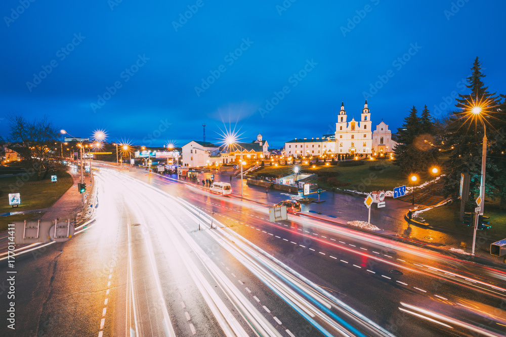 Minsk, Belarus. Night Traffic On Illuminated Street And Cathedral Of Holy Spirit In Minsk.