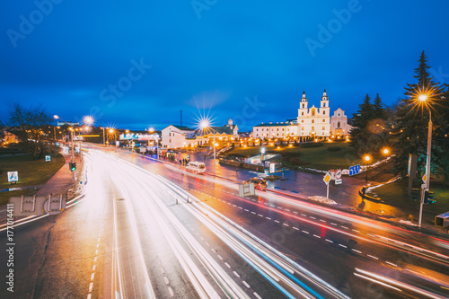 Minsk, Belarus. Night Traffic On Illuminated Street And Cathedral Of Holy Spirit In Minsk.