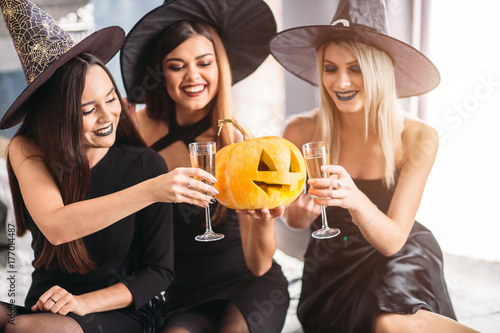 Friends drinking during Halloween night photo