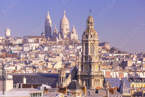 Aerial view of Sacre-Coeur Basilica or Basilica of the Sacred Heart of Jesus at the butte Montmartre and Saint Trinity church in the morning, Paris, France