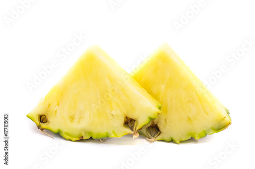 Fresh cut pineapple. Pieces isolated on white background. Two