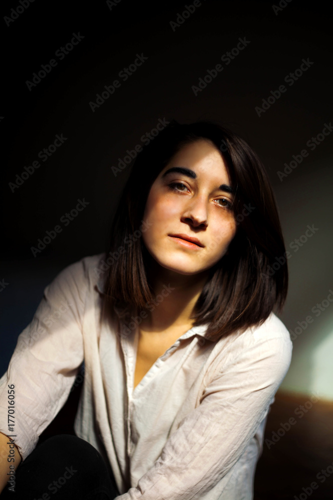 Portrait of a young woman looking at camera Portrait of a young woman looking at camera