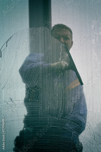 Window washer cleaning with squeegee
