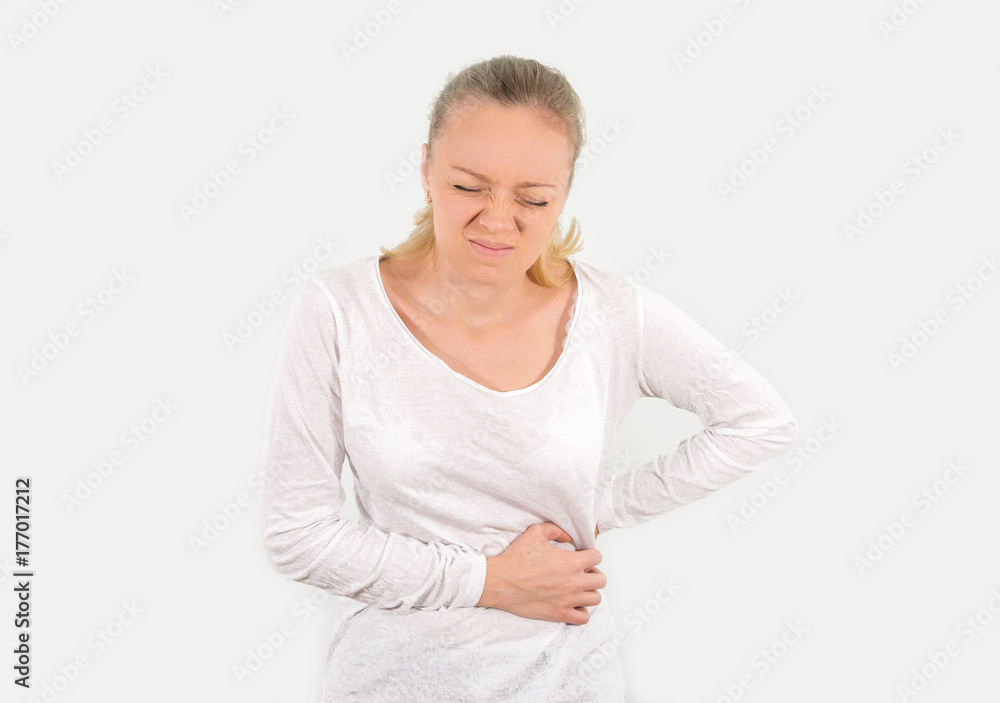 The young girl blondes stomach ache. mockup. Isolated on a white background. The young girl blondes stomach ache. mockup. Isolated on a white background.