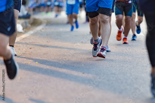 Group of people exercise race marathon in the city.