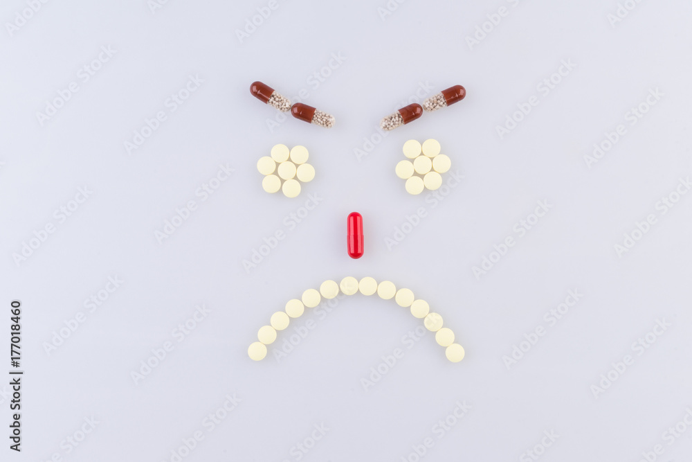 Tablets in the form of sad faces Tablets in the form of sad faces