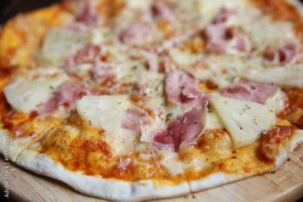 pizza hawaiian , pizza with pineapple and ham with cheese and tomatoes sauce on wood background , italian food pizza hawaiian , pizza with pineapple and ham with cheese and tomatoes sauce on wood background , italian food