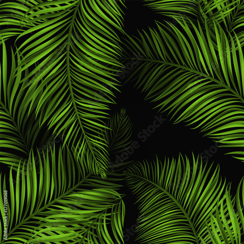 Beautiful tropical summer seamless pattern. Realistic palm leaves, brigh green color on black background