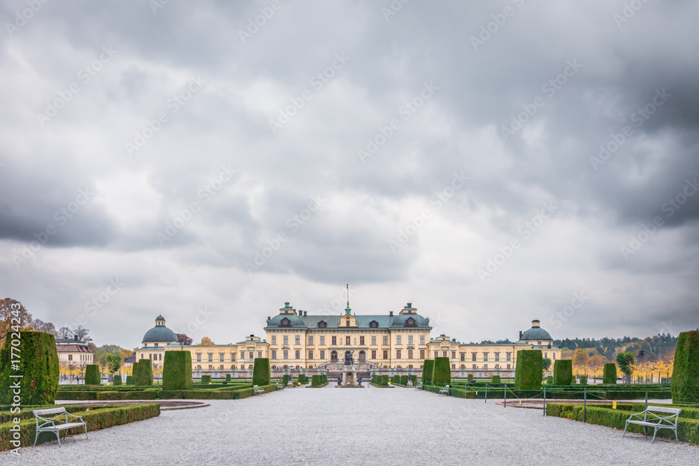 View over Drottningholm Palace and park on a cloudy autumn day. Home residence of Swedish royal family. Famous landmark and tourist destination in Stockholm, Sweden