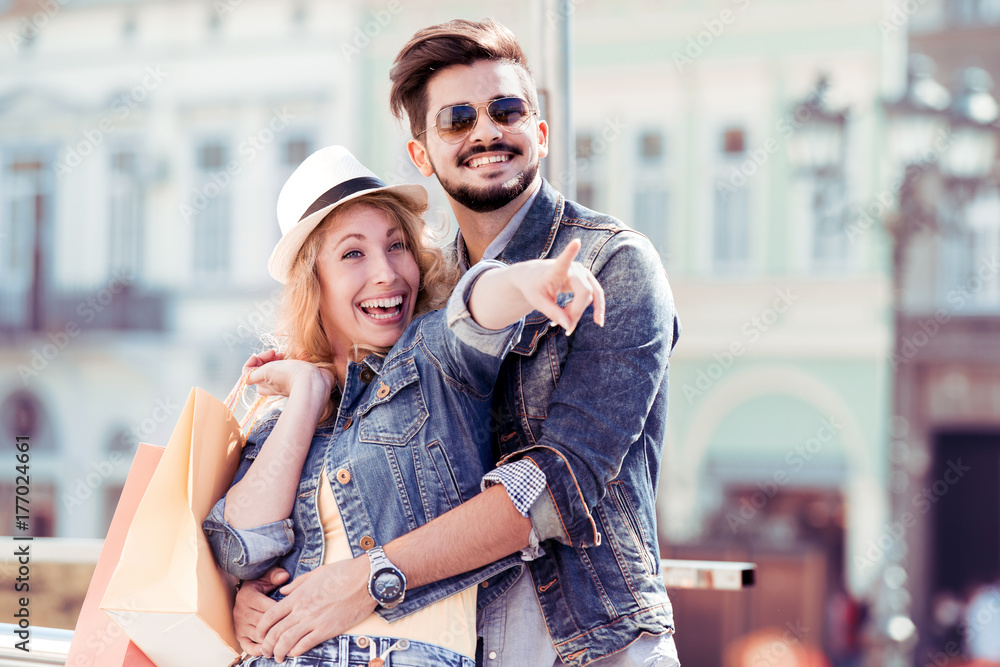 Beautiful couple enjoying shopping together. Beautiful couple enjoying shopping together.
