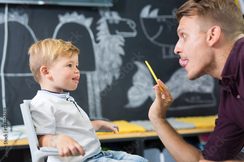 Картината върху платно Cute little boy at speech therapist session