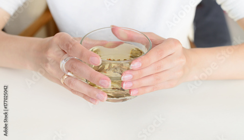 Herbal tea in woman hands