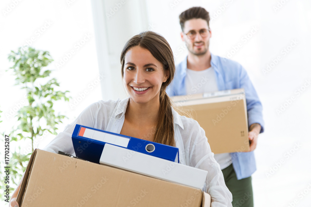 Beautiful young couple moving at new home. Beautiful young couple moving at new home.