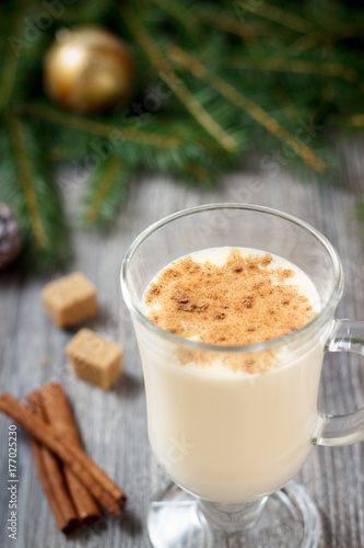 Christmas drink eggnog with grated nutmeg and cinnamon