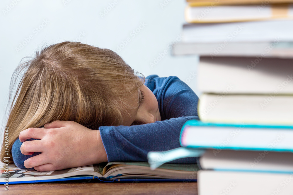 Sleeping girl with book on white background Sleeping girl with book on white background