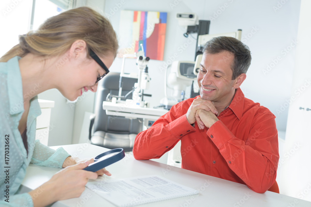 doctor and patient are discussing insurance policy