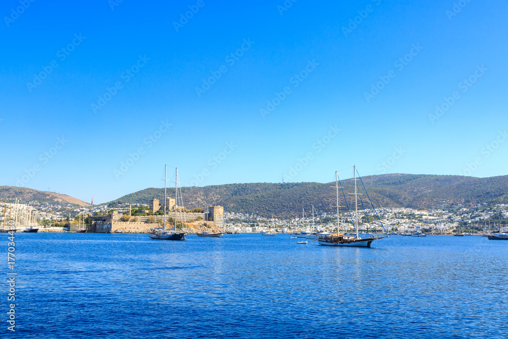Bodrum castle from sea with boats in Bodrum, Turkey