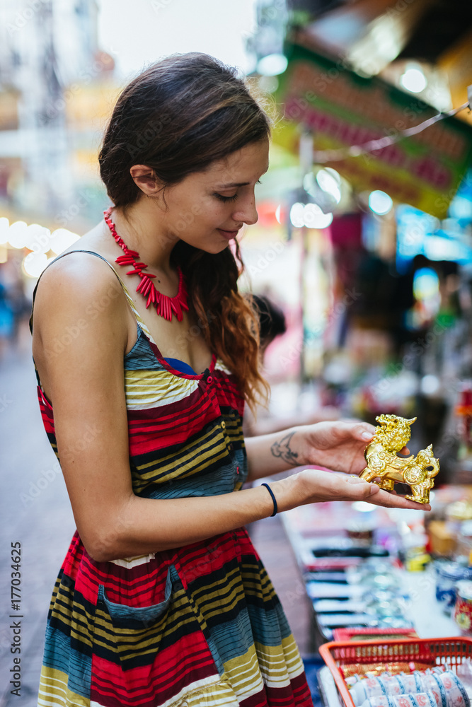 Woman visiting a market in Bangkok, Thailand. Woman visiting a market in Bangkok, Thailand.
