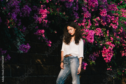 Woman in front of Pink Flowers photo