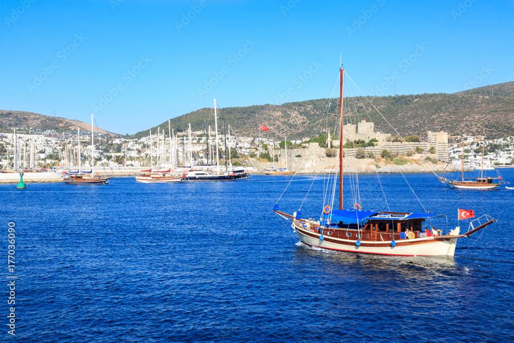 Bodrum castle from sea and boat in Bodrum, Turkey