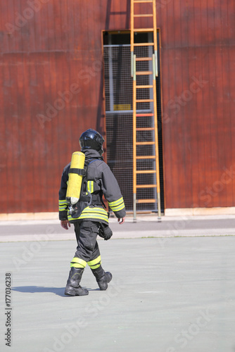 firefighter with the oxygen cylinder