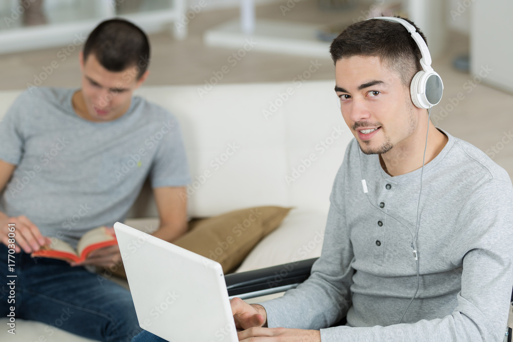 two teens with notebooks are preparing for school at home two teens with notebooks are preparing for school at home