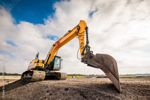 Big excavator in construction site