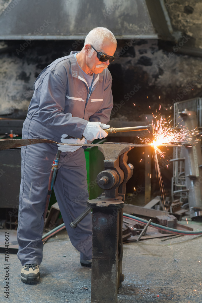 worker cutting metal worker cutting metal
