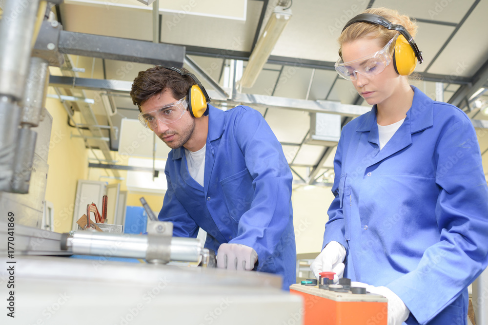 Male and female factory workers Male and female factory workers
