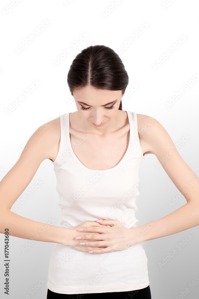 Pain. Woman hand holding abdominal with stomach ache lying on bed, health care and medical concept Pain. Woman hand holding abdominal with stomach ache lying on bed, health care and medical concept