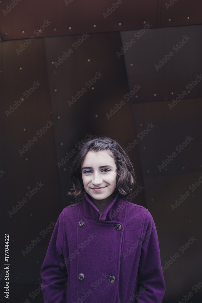 Portrait of happy eleven year old girl, in front of modern building Portrait of happy eleven year old girl, in front of modern building