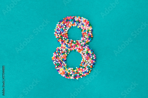 The number eight built from nonpareils photo