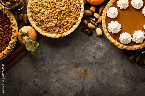 Fall traditional pies pumpkin, pecan and apple crumble photo