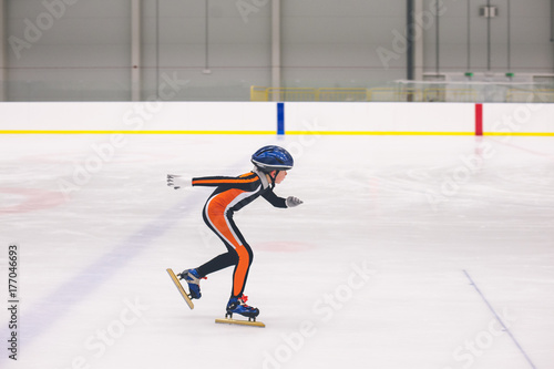 Boy practicing short track speed skating