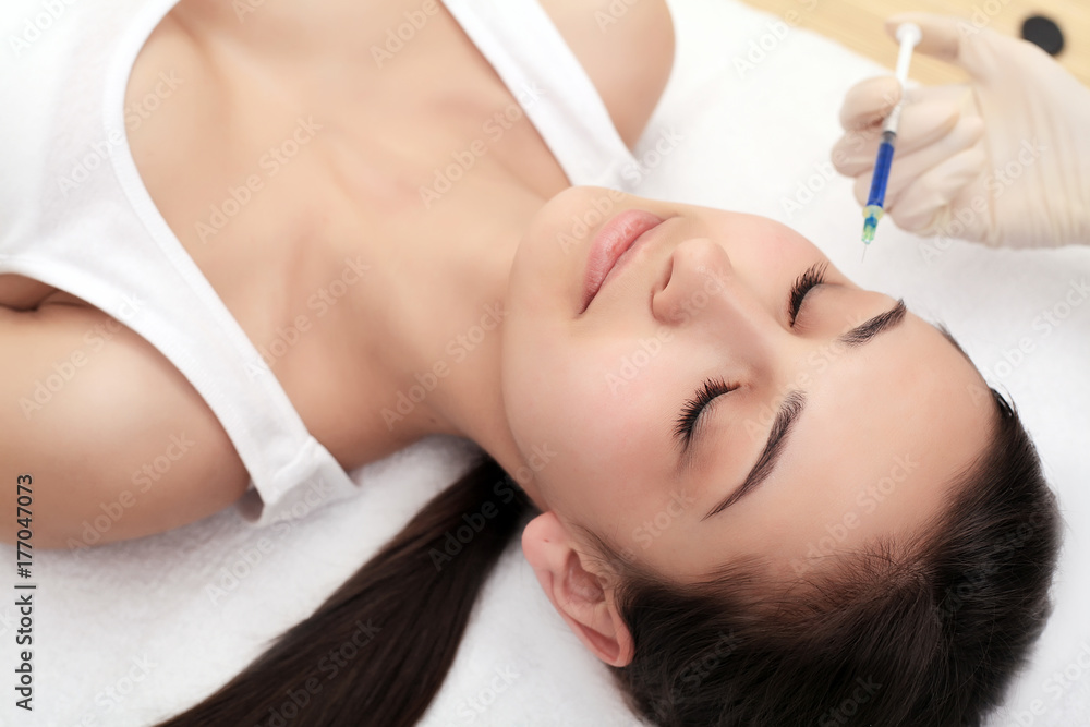 Woman Having Injection In Lips As Beauty Treatment Woman Having Injection In Lips As Beauty Treatment