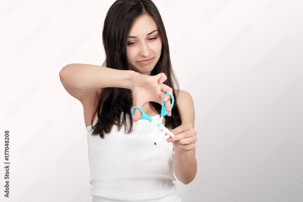 Young happy woman with broken cigarette. Stop smoking concept. Young happy woman with broken cigarette. Stop smoking concept.