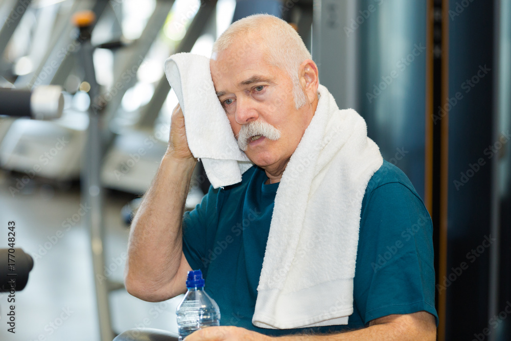 Fototapeta premium fit senior man resting after working out