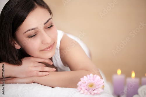 Body Care. Spa Woman. Beauty Treatment Concept. Beautiful Healthy Caucasian Girl Relaxing On Massage Table Before Hand Massage On Relaxed Back In Health And Spa Salon. Skin Care, Wellness, Lifestyle