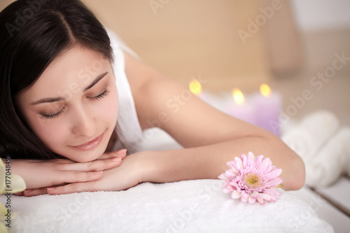Spa woman. Female enjoying relaxing back massage in cosmetology spa centre. Body care  skin care  wellness  wellbeing  beauty treatment concept.