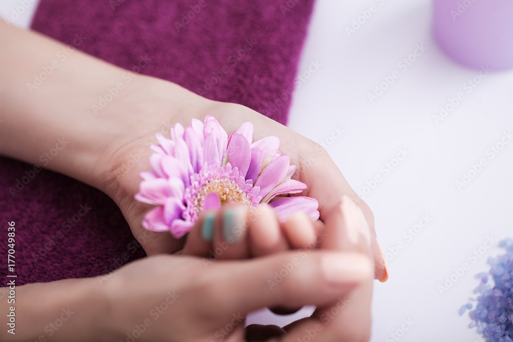Beautiful manicure. Spa treatments of nails and hands. Soaking the hands in the handkerchief. The concept of spa and beauty. Beautiful manicure. Spa treatments of nails and hands. Soaking the hands in the handkerchief. The concept of spa and beauty.