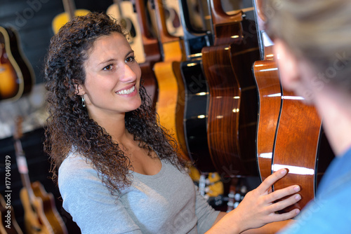 Woman in guitar shop