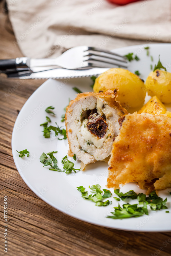 Chicken breast stuffed with cheese and dried tomatoes. Chicken breast stuffed with cheese and dried tomatoes.