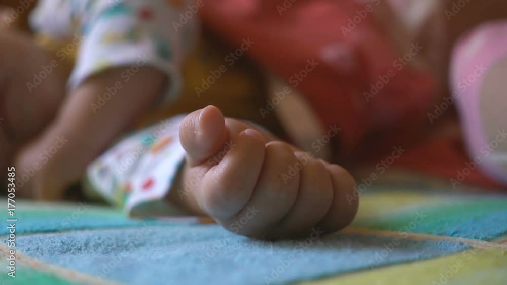 portrait of a sleeping and waking up baby in bed portrait of a sleeping and waking up baby in bed