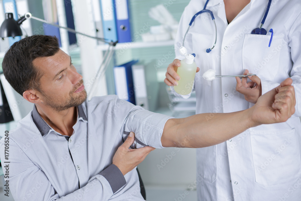 patient ready for injection while doctor holding syringe patient ready for injection while doctor holding syringe