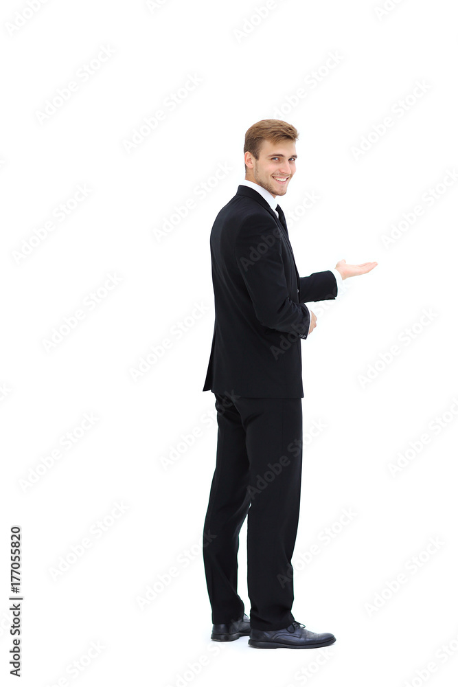 rear view.smiling businessman pointing forward. photo in full growth. rear view.smiling businessman pointing forward. photo in full growth.