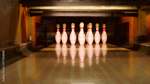 Bowling ball knocking pins on the bowling lane
